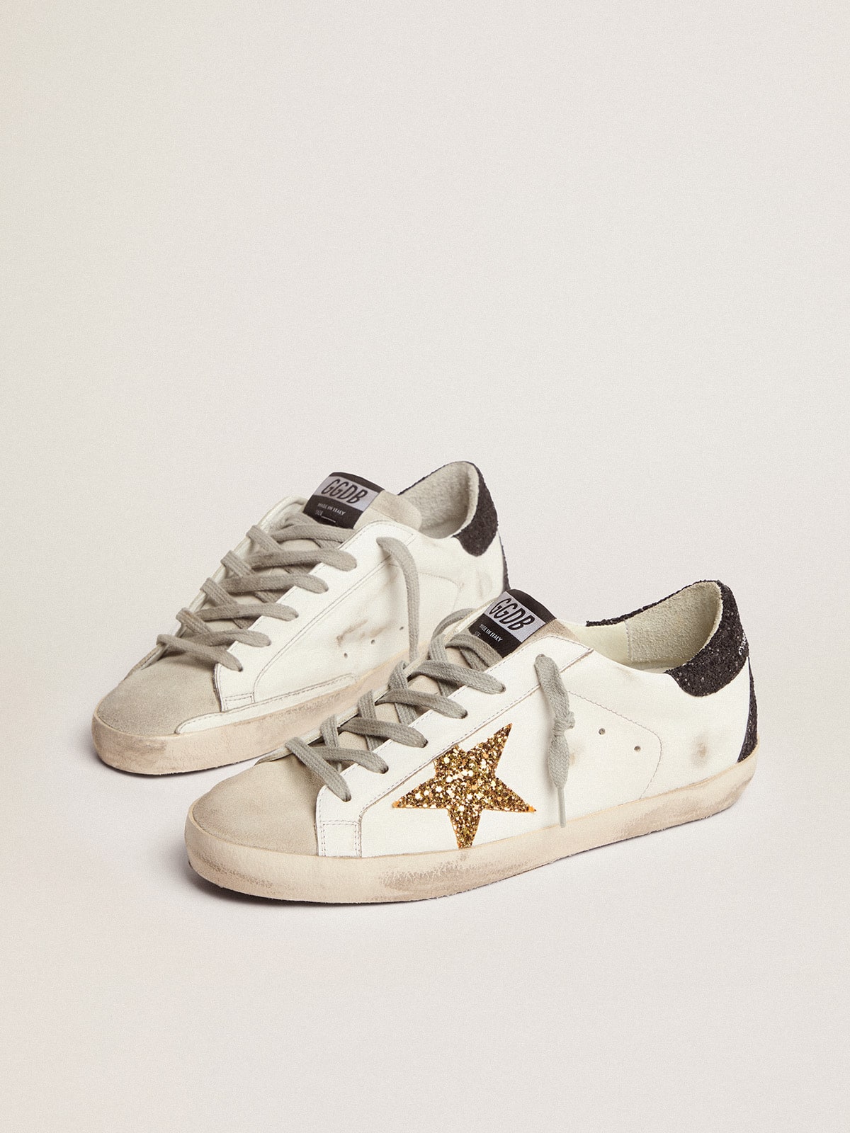 Golden goose in nappa leather with gold glitter star and black glitter heel tab