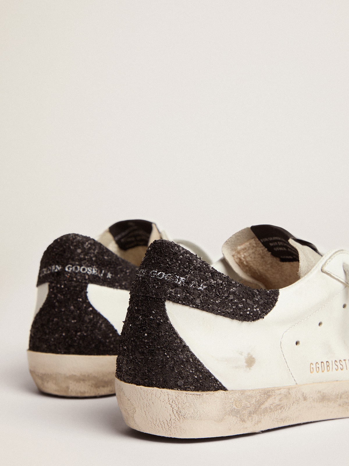 Golden goose in nappa leather with gold glitter star and black glitter heel tab