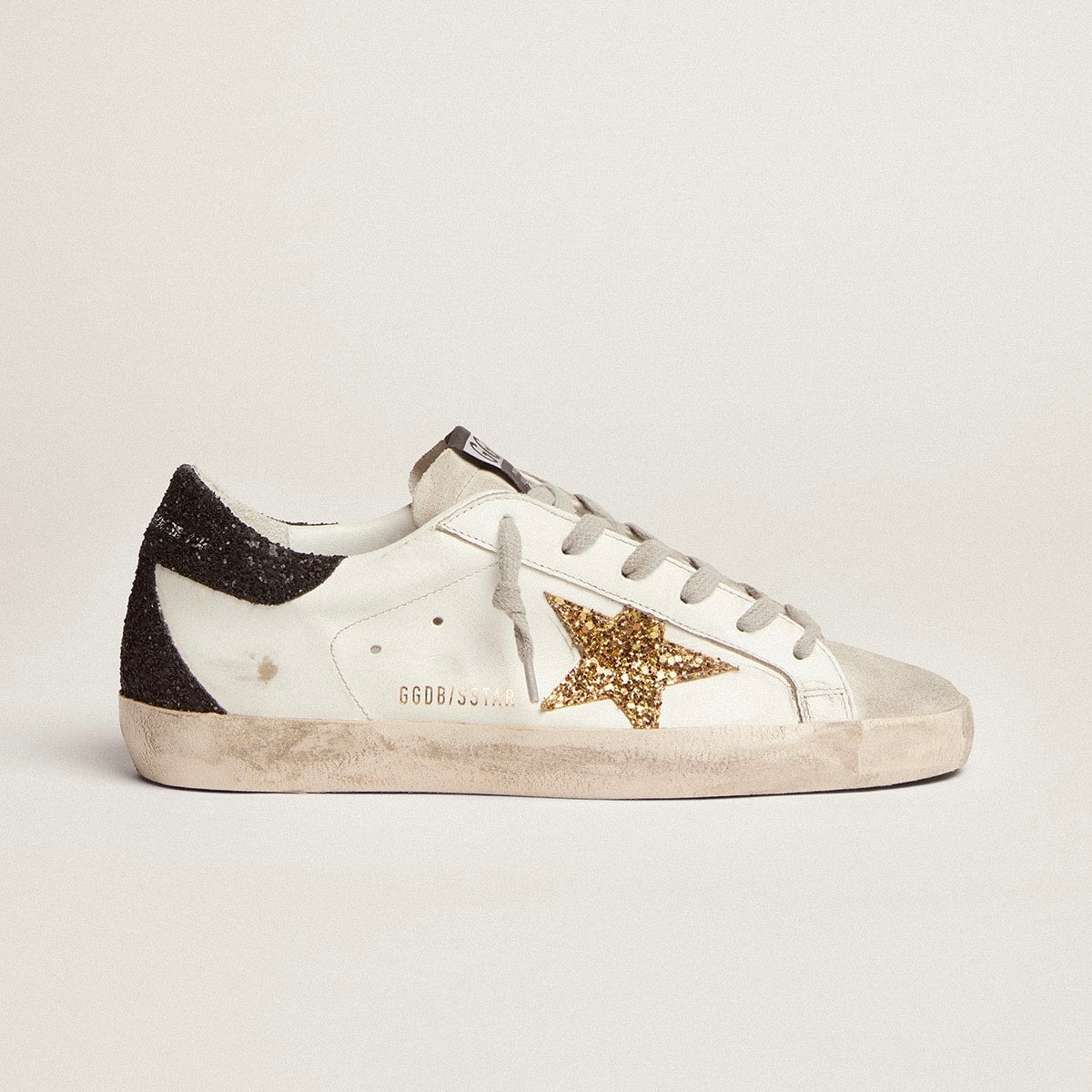 Golden goose  in nappa leather with gold glitter star and black glitter heel tab